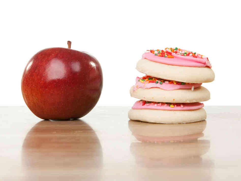 An apple and a stack of cookies