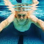 A man swims in a pool