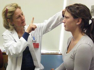 Neurologist Francis Jensen examining a teenage patient.