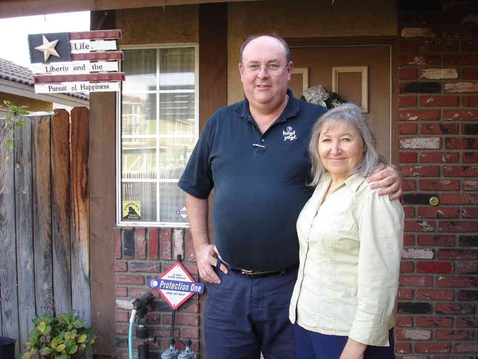 William and Laura Betts standing in front of their home on Dana Lane.