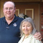 William and Laura Betts standing in front of their home on Dana Lane.