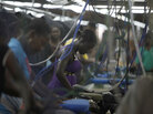 Women work at the DKDR garment assembly factory in Port-au-Prince, Haiti Women work at the DKDR garment assembly factory in Port-au-Prince, Haiti