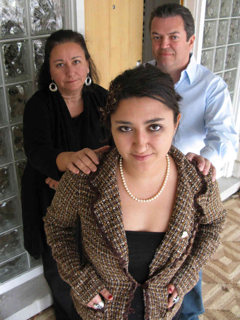Margaux with her parents. Margaux with her parents.