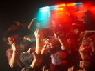 College students dance at a party. College students dance at a party.