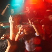 College students dance at a party.