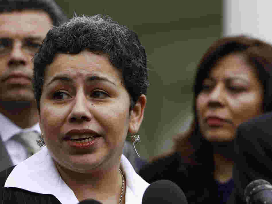 Clarissa Martinez de Castro of the National Council of La Raza talks to reporters.