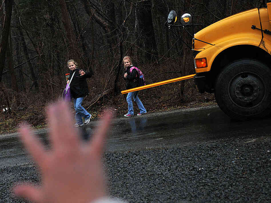 Kristy Stumpf meets her daughters at the school bus stop Kristy Stumpf meets her daughters at the school bus stop