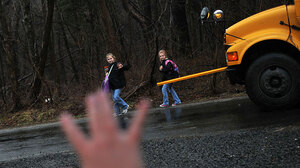 Kristy Stumpf, who works from her home in Broad Run, Va., part of the week, greets her daughters Lauren, 9 (left), and Lacey, 6 (right), as they hop off the school bus. Stumpf's employer, List Innovative Solutions, lets employees largely set their own hours.