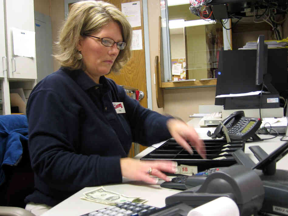 Tina Burgess in the front office of a grocery store in Michigan.