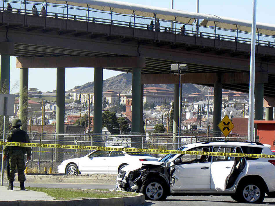 A Mexican soldier patrols the scene where three U.S. consulate staffers were slain in Ciudad Juarez.
