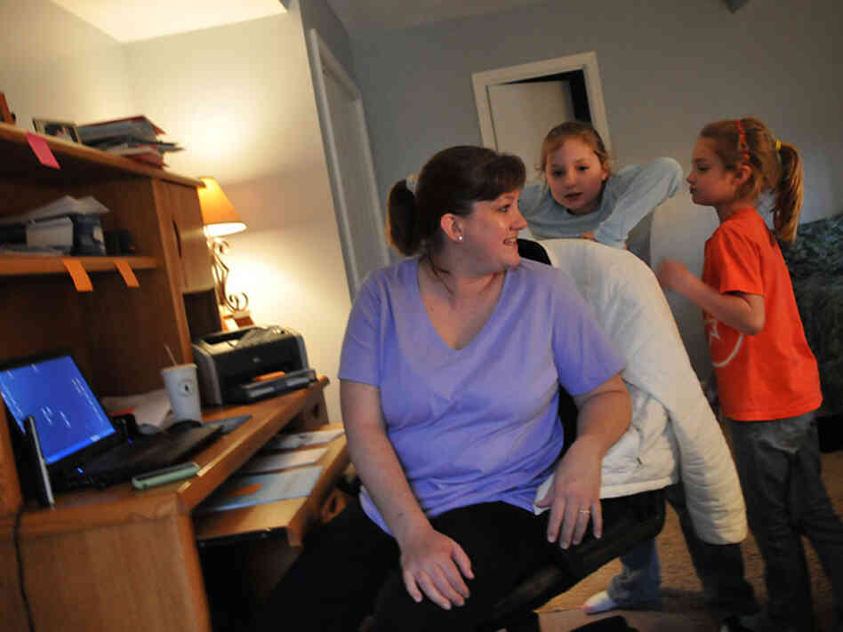 Stumpf spends time with her daughters while getting some work done in her home office