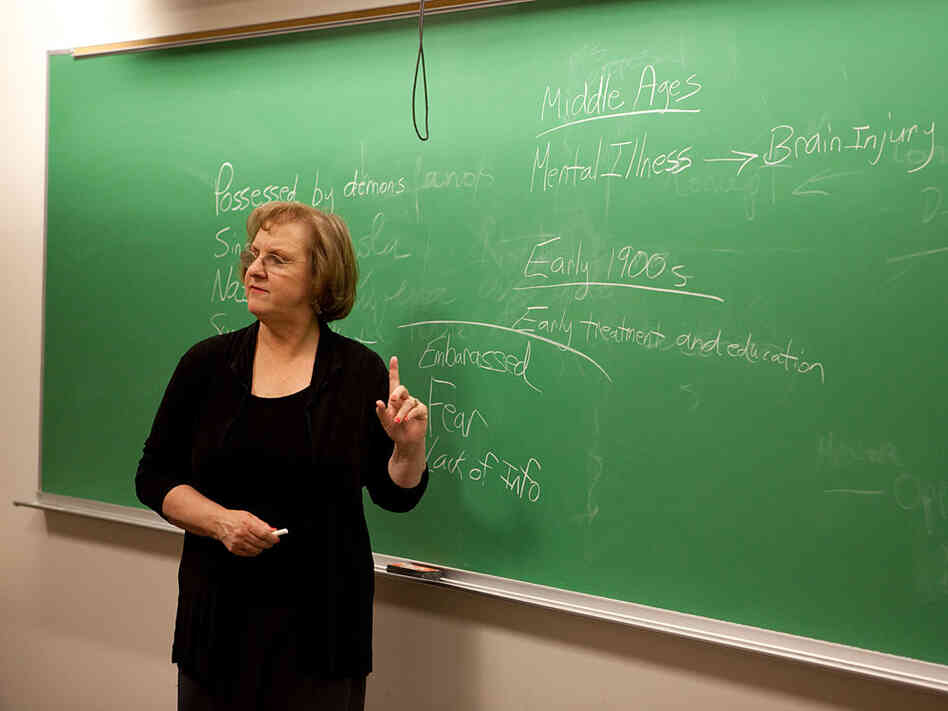 Janis Ruoff, a professor at The George Washington University, uses a blackboard.
