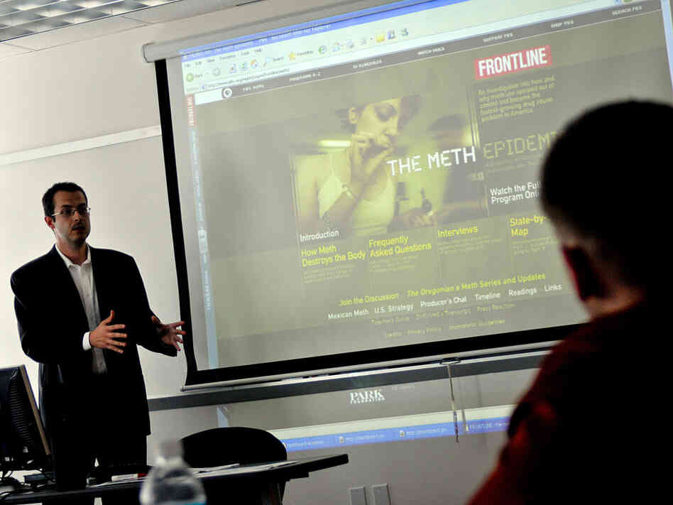 Frederic Lemieux projects information from a computer while teaching a police science class.