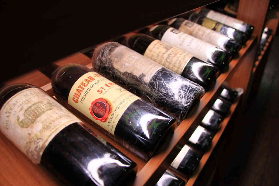 Chen's wine cellar includes expensive bottles of Chateau Margaux from 1934 Chen's wine cellar includes expensive bottles of Chateau Margaux from 1934