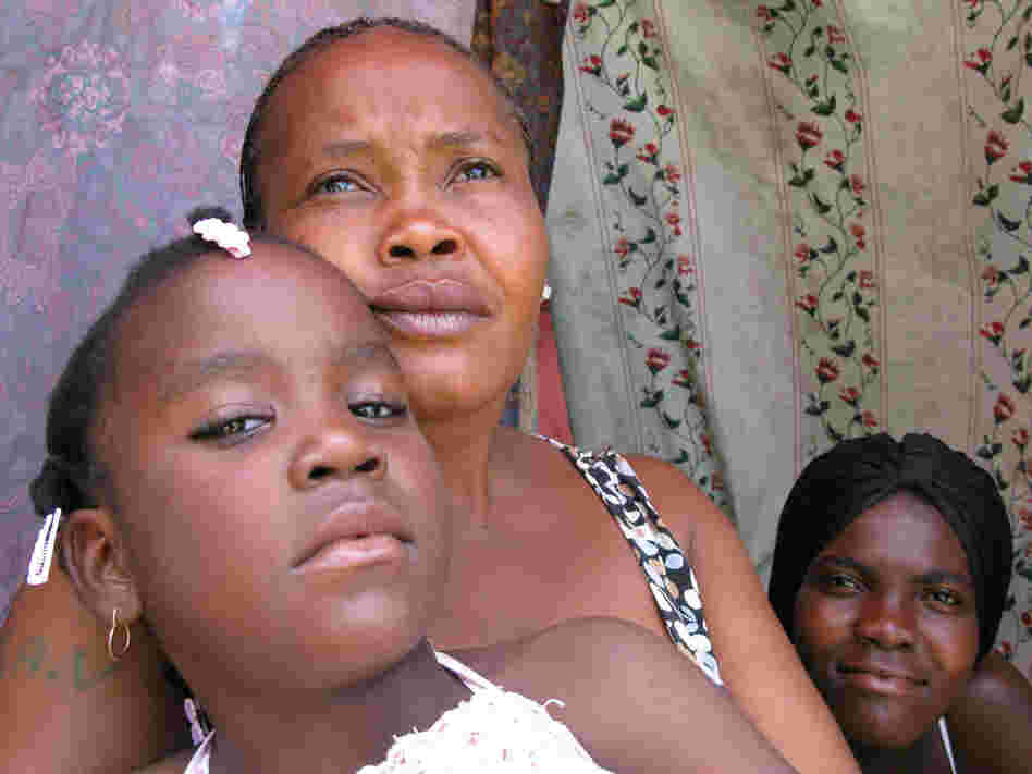 Marie Claudine Macena and her daughters, residents of Petionville Club camp