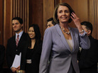 House Speaker Nancy Pelosi walks past House staff as she arrives to give a speech on health care. House Speaker Nancy Pelosi walks past House staff as she arrives to give a speech on health care.