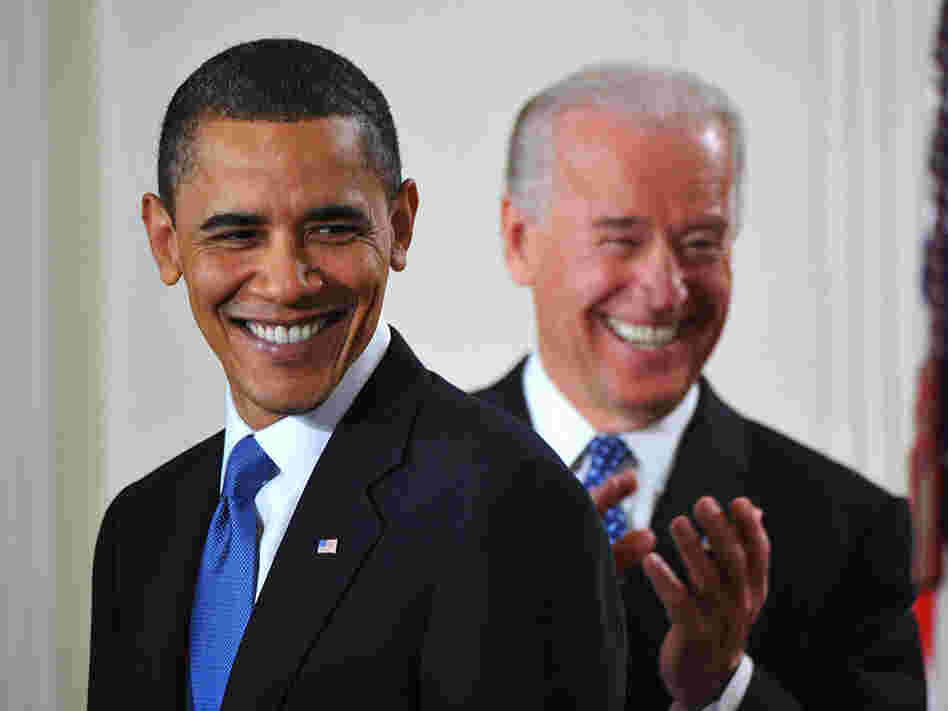 President Obama smiles before signing the health insurance reform bill