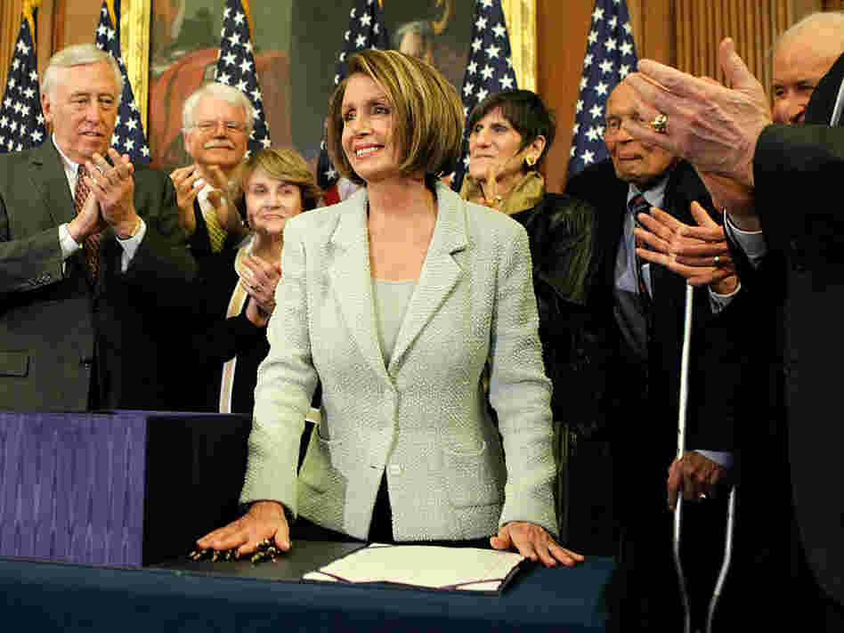 Democrats after signing the health care overhaul bill Monday.