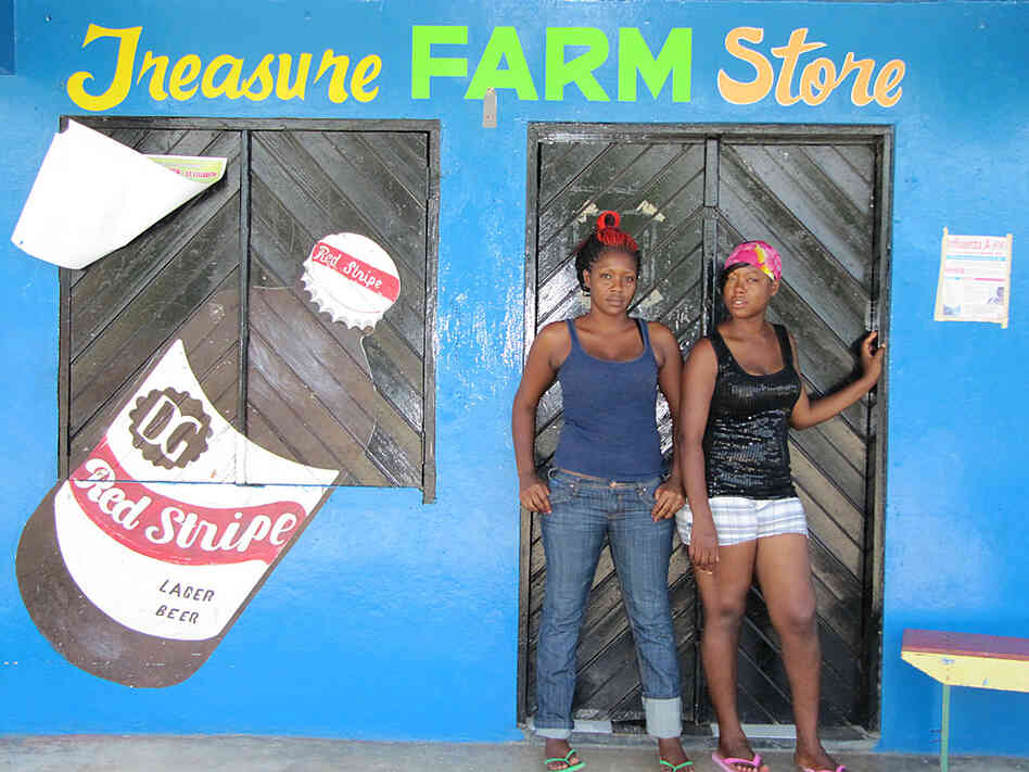 Kadesha Abrahms (left) at a feed store in Treasure Beach, Jamaica, says girls want to be slim.