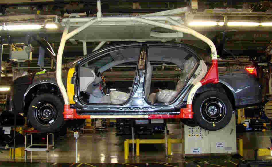 A car moves down the auto assembly line at New United Motor Manufacturing Inc. A car moves down the auto assembly line at New United Motor Manufacturing Inc.