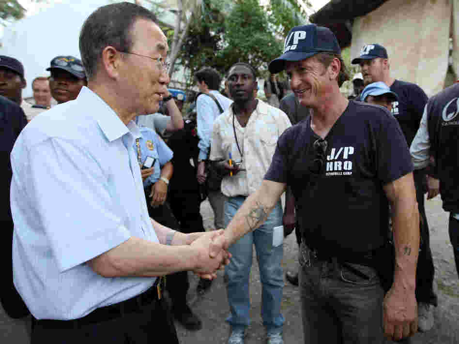 U.N. Secretary-General Ban Ki-moon greets actor Sean Penn in a Haitian tent camp.