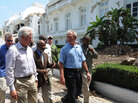 Former U.S. presidents George Bush and Bill Clinton walk with Haitian President Rene Preval. Former U.S. presidents George Bush and Bill Clinton walk with Haitian President Rene Preval.