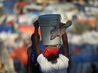 A woman carries water through a crowded refugee camp for earthquake victims on Feb. 7 in Haiti. A woman carries water through a crowded refugee camp for earthquake victims on Feb. 7 in Haiti.