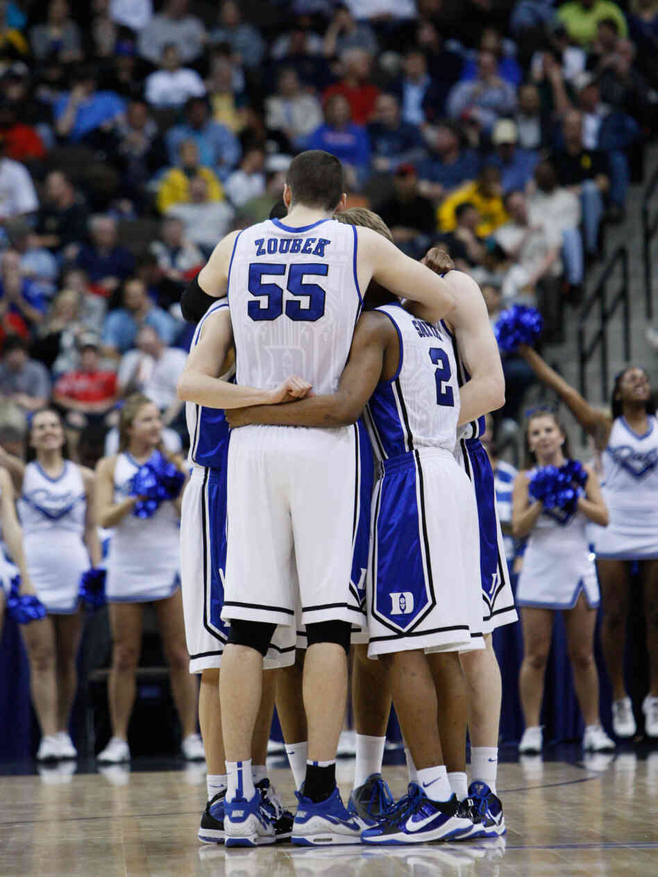 Duke teammates gather together against California in second-round play. Duke teammates gather together against California in second-round play.