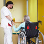 A patient and nurse in a nursing home A patient and nurse in a nursing home
