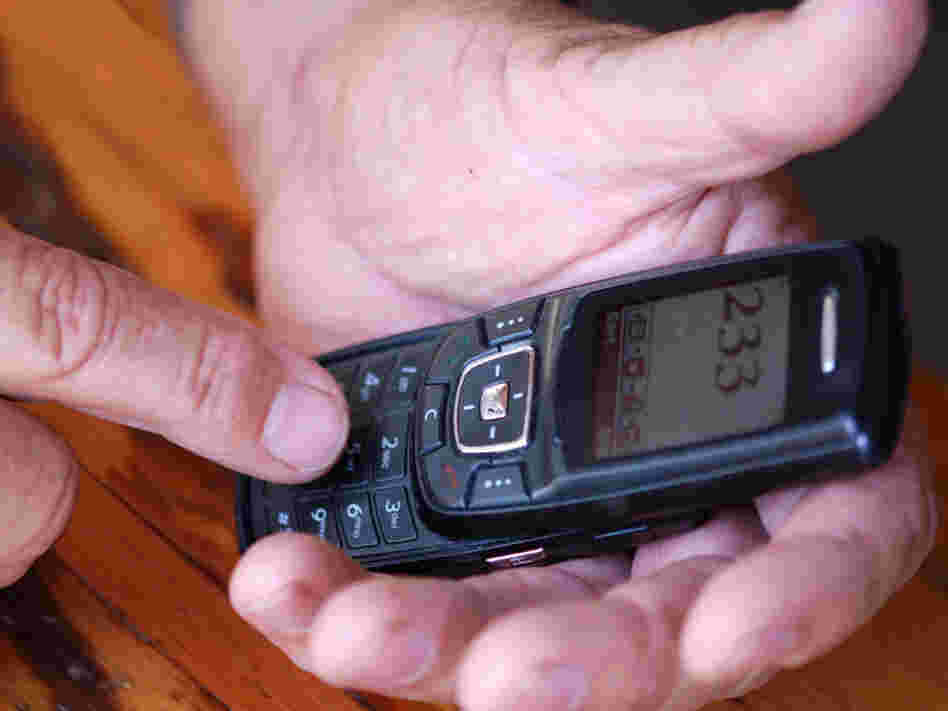 Hands holding a phone. iStockphoto.com
