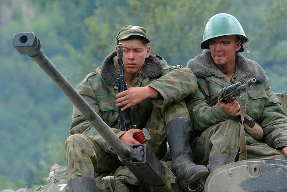 Russian soldiers seen atop a military vehicle in the disputed South Ossetia region in August 2008. Russian soldiers seen atop a military vehicle in the disputed South Ossetia region in August 2008.
