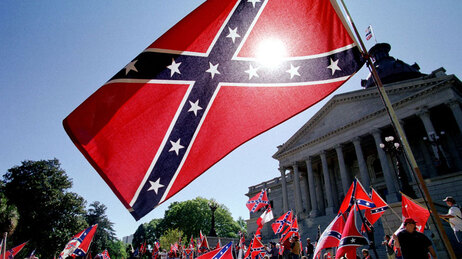 Confederate flag supporters demonstrate on the north steps of the capitol building 06 April, 2000 in Columbia, SC.