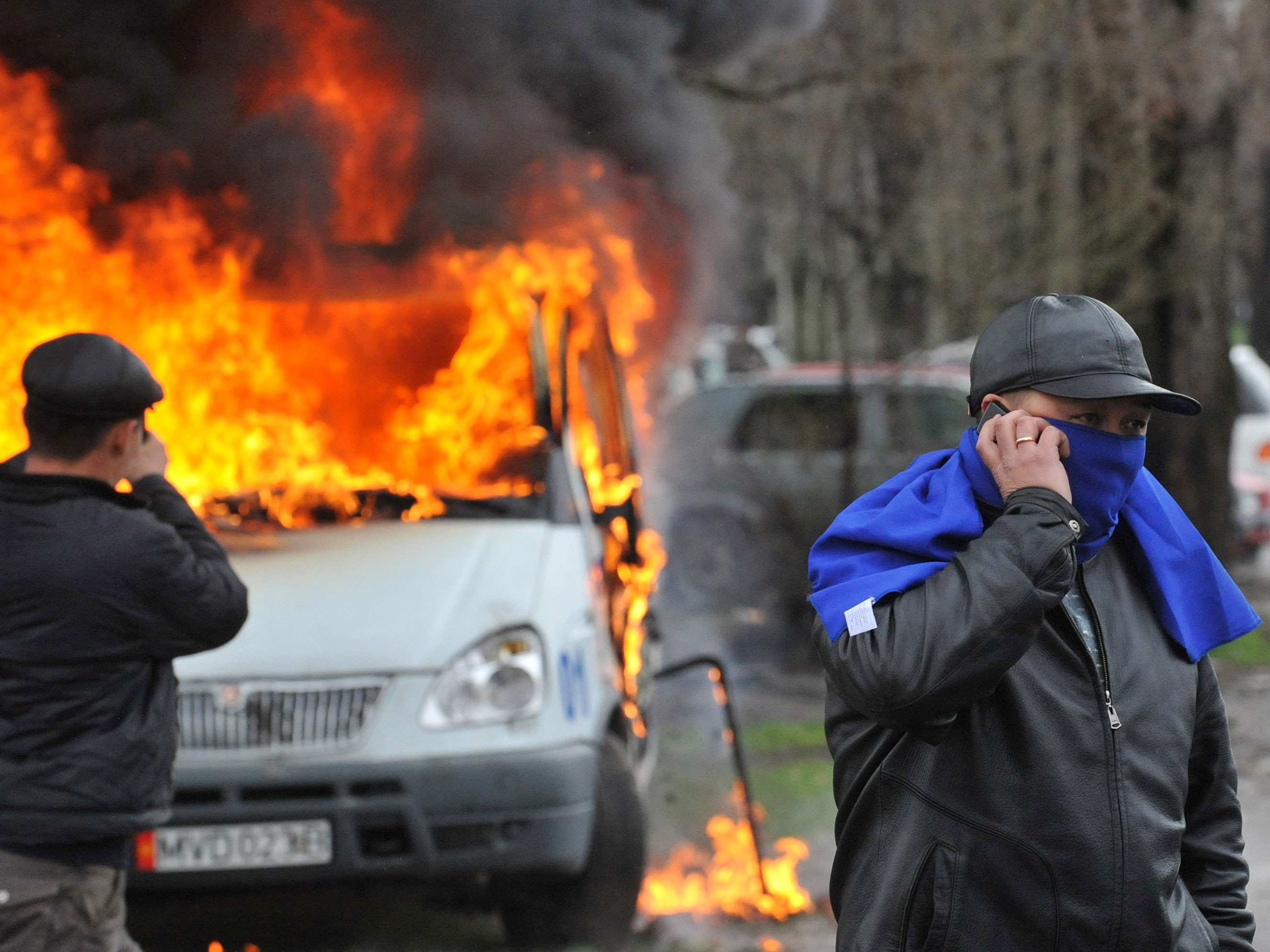 A car burns during an anti-government protest in Bishkek on April 7, 2010.
