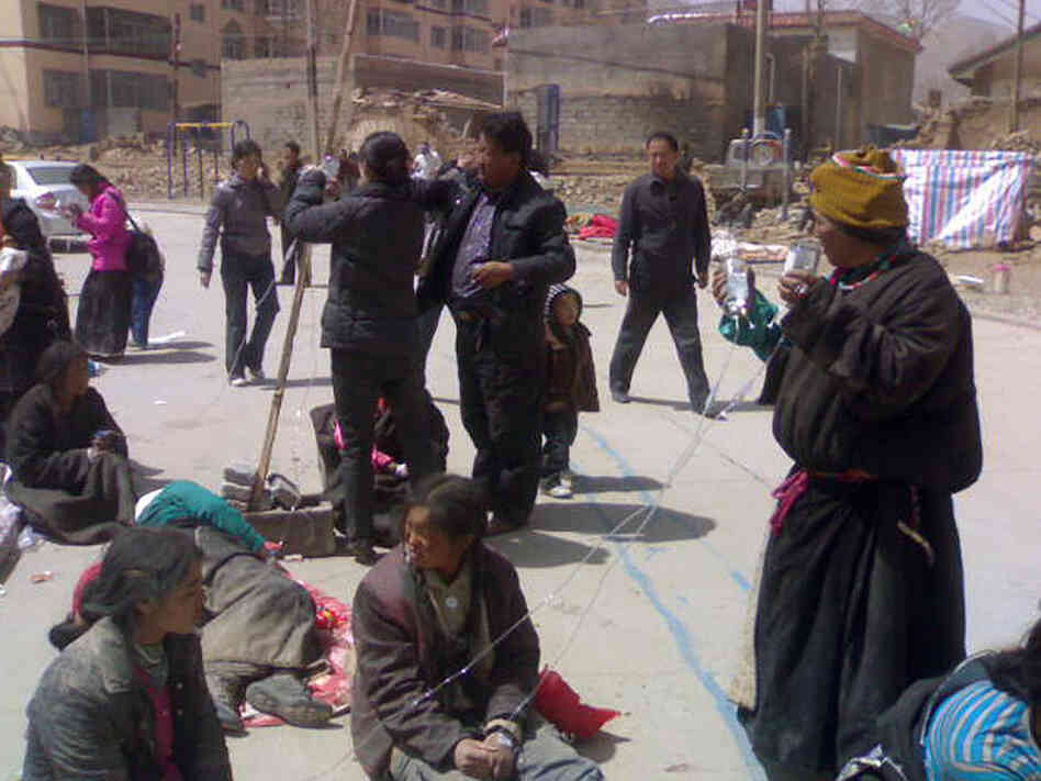 People gather outside after being evacuated