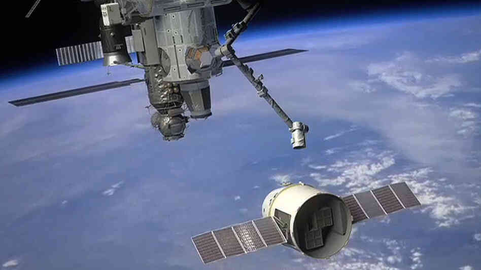 The Dragon spacecraft approaches the International Space Station The Dragon spacecraft approaches the International Space Station