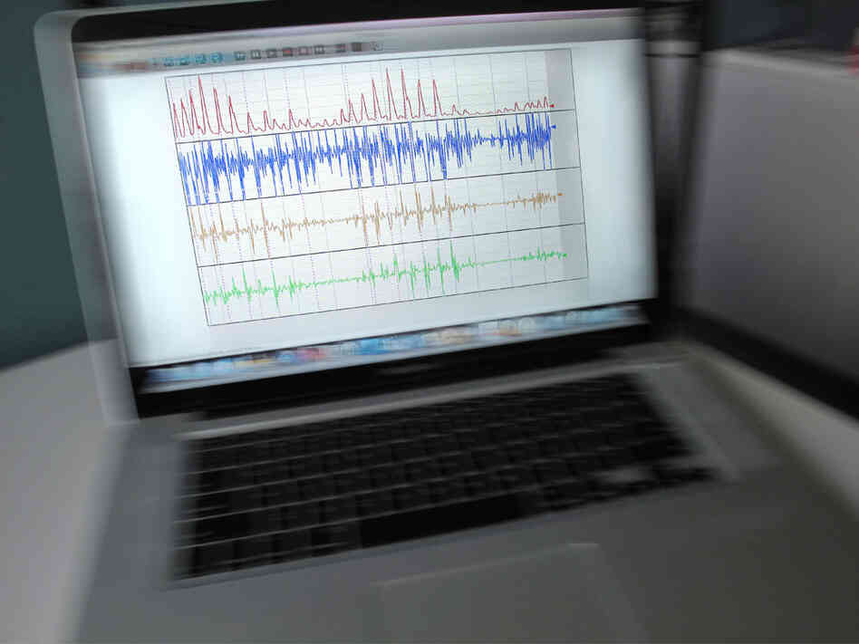 a photo illustration of a laptop shaking