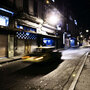 A taxi on a dark street. A taxi on a dark street.