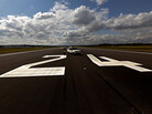 An airport vehicle on an empty runway in Edinburgh. An airport vehicle on an empty runway in Edinburgh.