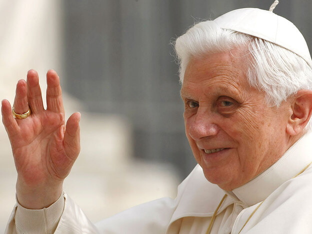 Pope Benedict XVI waves from the popemobile