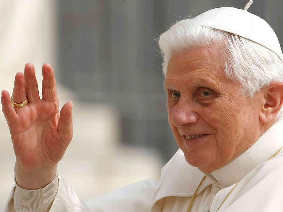 Pope Benedict XVI waves from the popemobile