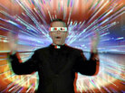 The Rev. Robert Reed, director of the CatholicTV Network, wearing 3-D glasses. The Rev. Robert Reed, director of the CatholicTV Network, wearing 3-D glasses.