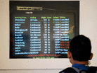A man checks the arrivals board in Terminal B at Newark Liberty International Airport on Monday. A man checks the arrivals board in Terminal B at Newark Liberty International Airport on Monday.