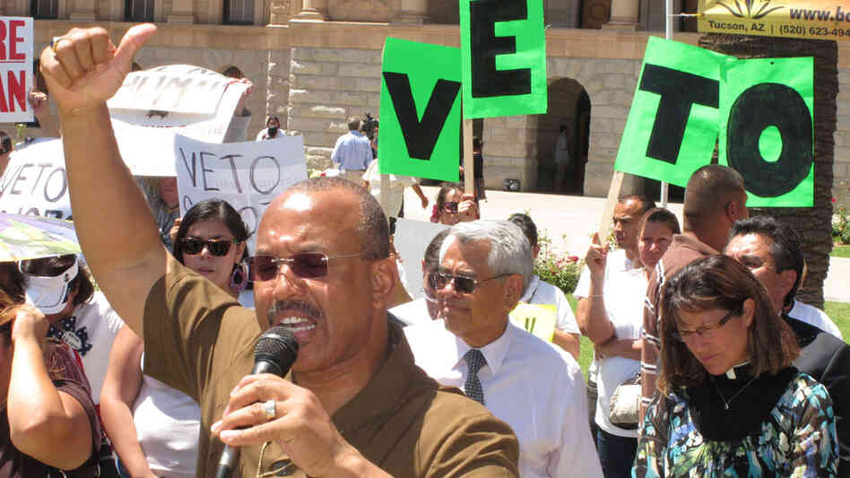 Activists protest Arizona's sweeping new immigration crackdown bill during a rally Tuesday.