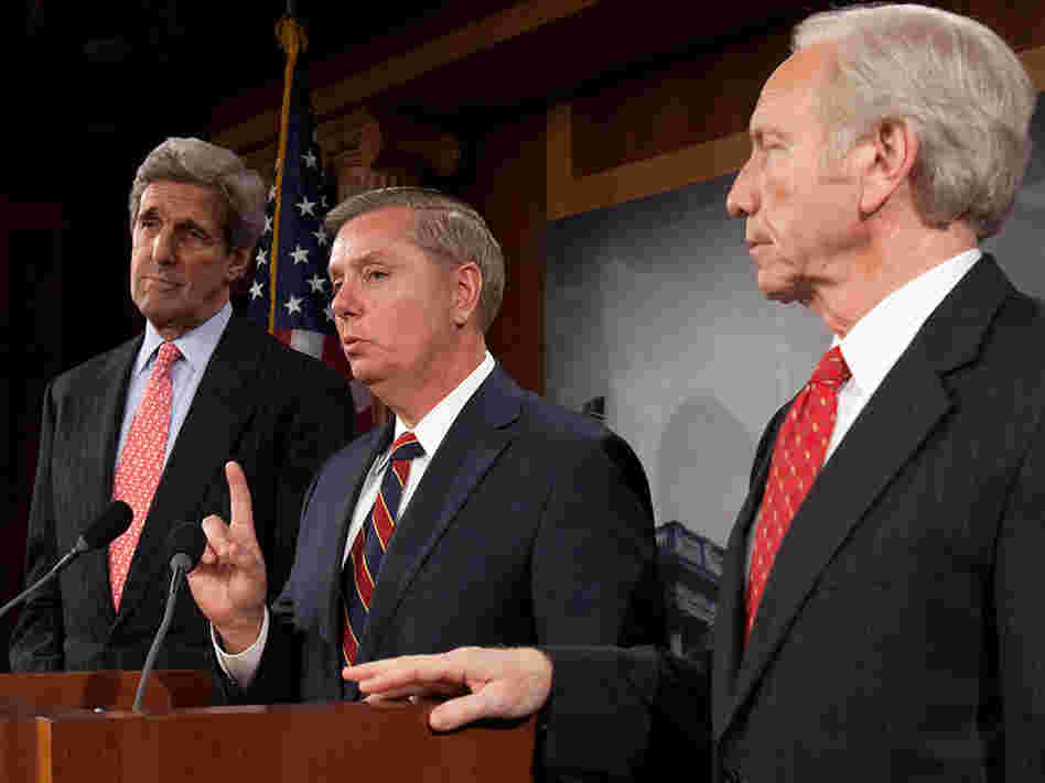Sens. John Kerry (left) and Joseph Lieberman (right) and Sen. Lindsey Graham