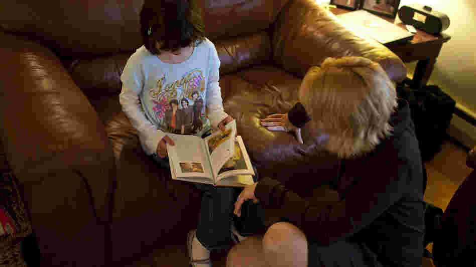 Isabelle reads a book with her mom Isabelle reads a book with her mom