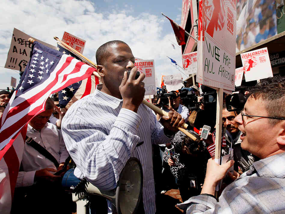 Protesters square off over Arizona's immigration law outside a Cubs-Diamondbacks game in Chicago.