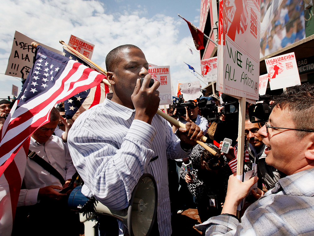 Protesters square off over Arizona's immigration law outside a Cubs-Diamondbacks game in Chicago.