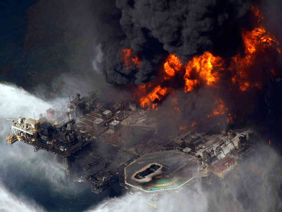 The Deepwater Horizon oil rig is seen burning.