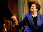 Elena Kagan shakes hands with Harry Reid Elena Kagan shakes hands with Harry Reid