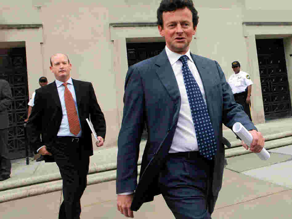 BP CEO Tony Hayward (right) and BP America Chairman Lamar McKay leave the Department of the Interior